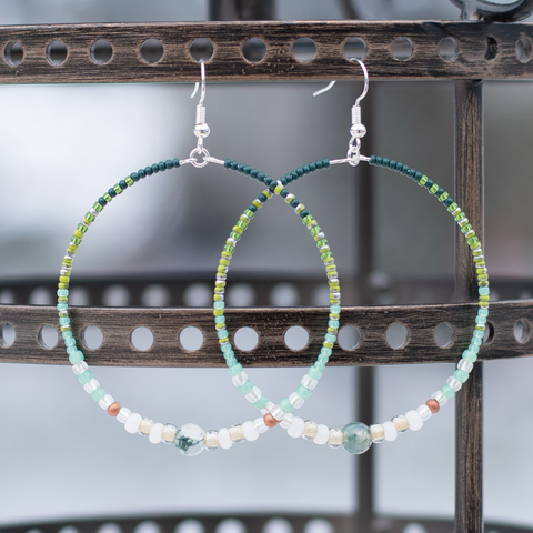 Green beaded earrings with copper accent beads