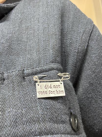 Small pin saying “I did not vote for him.”