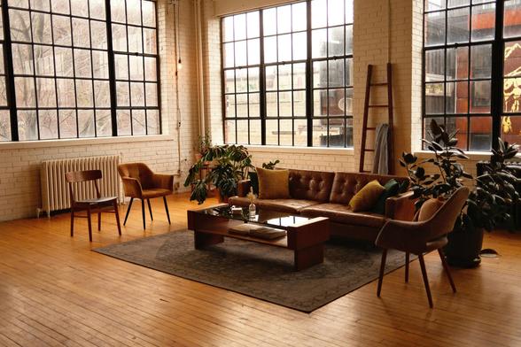 A well-furnished living room showcasing a couch, a chair, and a table, creating an inviting atmosphere