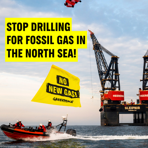 Greenpeace activists in action at sea against fossil gas near a fossil gas rig. Greenpeace banner reads: NO NEW GAS!. Caption: Stop drilling for fossil gas in the North Sea! 