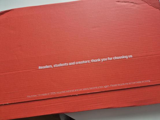 A red delivery bok with the text: readers, students and creators; thank you for choosing us.