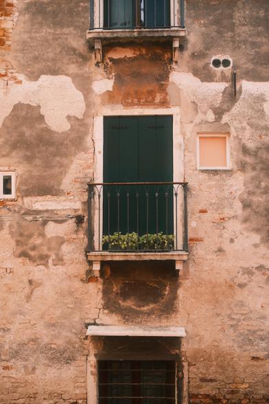 Small balcony with shut doors in Venice