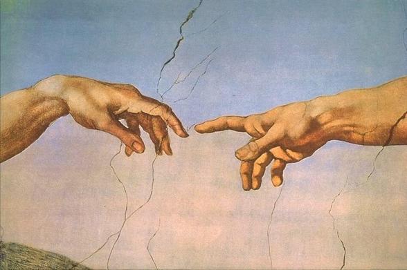Close up of Adam & God’s hands in Michaelangelo’s Creation of Adam
