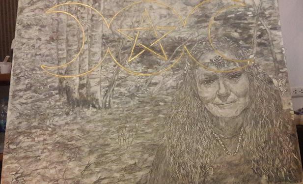 a painting of a forest in black and white, on the right side is a woman with long hair looking at the viewer, wearing necklaces, she has a headband with a flower on it around her head, in thin gold paint at the top is a large symbol for 'crone' , two half moons facing outwards with a star in a circle in the middle 