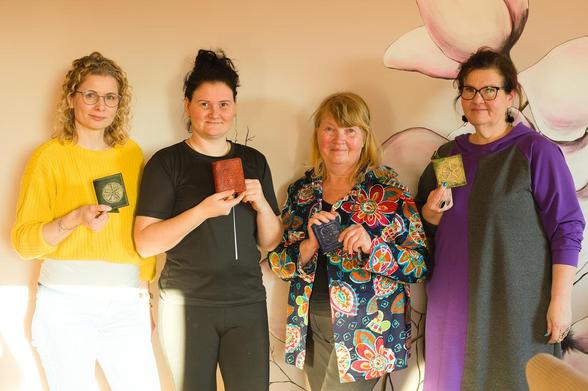 My students on this bright sunny day - standing tall and proud, holding finished leather card wallets in hand. Hand carved and hand stitched!