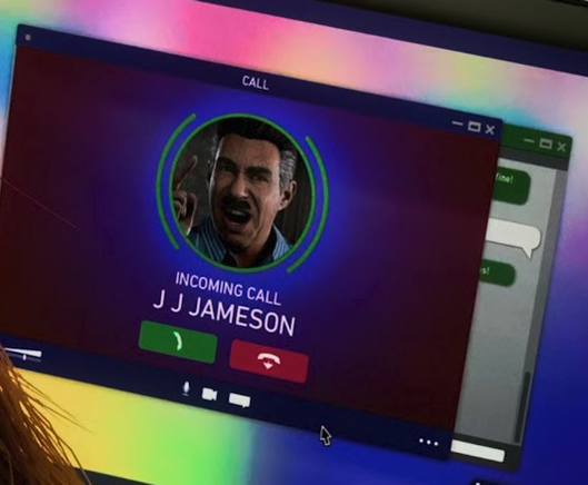 Screenshot of Spider-Man 2. "incoming call, J J Jameson" is displayed in a calling app on a laptop.