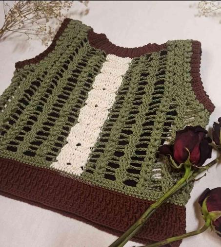 Crocheted top featuring a spine design in off-white, olive green, and brown yarn.