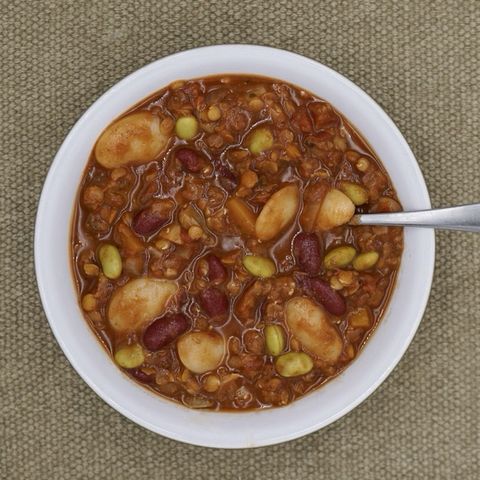 A bowl of lentil and bean chilli. 