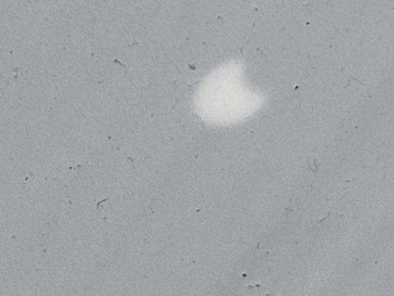 Image of the sun being partially obscured by the sun on a white background