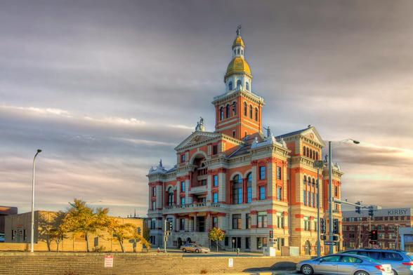 Dubuque County Courthouse
A grand historic building stands prominently against a dramatic sky, showcasing intricate architectural details with a tall clock tower