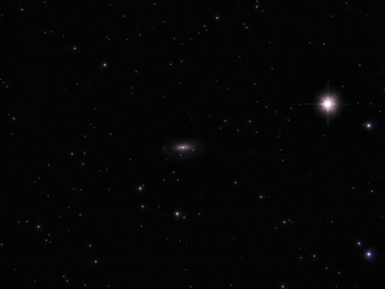 NGC 5033 galaxy at the center, with HIP 64530 to the right. 