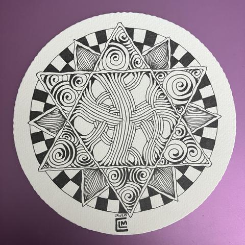 Inking finished: the patterns are centred around a large hexagon in the middle of the circular zendala, with 12 radiating triangles and fill each of the shapes