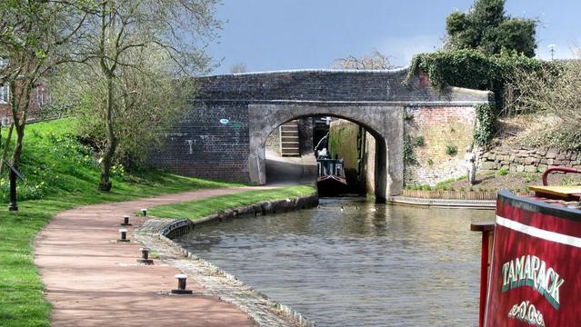 A photo titled "The Trent and Mersey Canal at Stone", taken near Bridge 94, Hospital Bridge by David Jones on Flickr.
