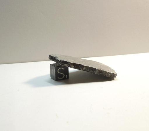 Edge view of a slice of Muonionalusta iron meteorite.