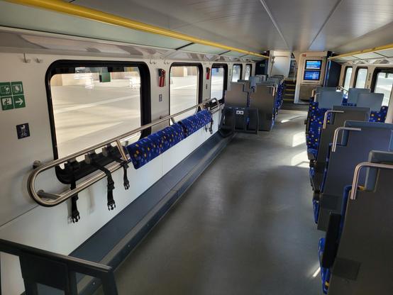 Inside: downstairs room is 5 window long. First 2.5 windows: right half made of seats and left half free to put bicycles, strollers, etc. Last 2.5 windows: same with left & right mirrored.