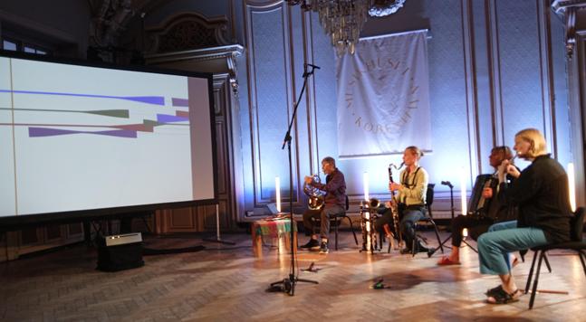 CBN in an ensemble playing a moving graphic score by Cat Hope in Copenhagen 2023