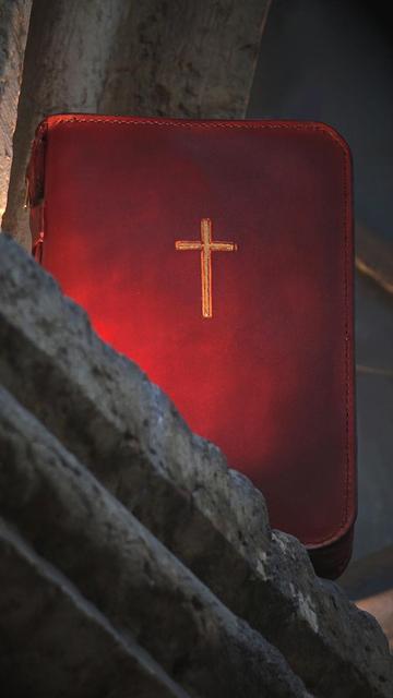 Photo shows the leather covers from front. There is a hand carved cross on the front cover. Cross is painted in gold and it looks very beautiful on these mahogany color leather covers.  