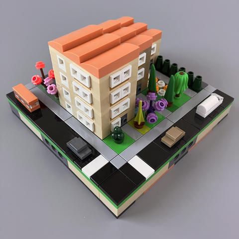 Front corner view showing a 4 storey block right on one pavement