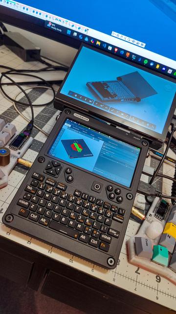 ClockworkPi UConsole showing an added 7" display with fusion360 and prusaslicer.