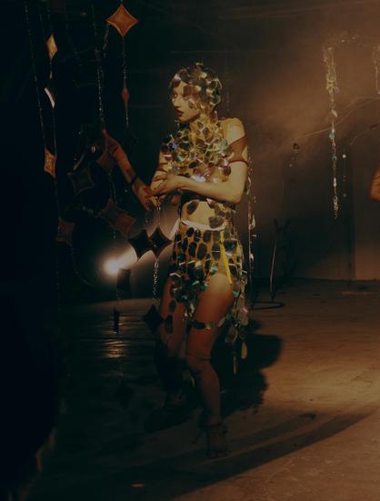 A techno creature dancing in their wold