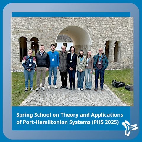 Group picture of PHS2025 attendants from ModConFlex in front of a medieval wall.