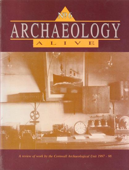 The front cover of Archaeology Alive No 6: A Review of Work by the Cornwall Archaeological Unit for 1997-1998. Plain ox-blood brown with title in white and a large sepia photo of the interior of the Marconi Wireless Station on The Lizard, taken in c.1901.