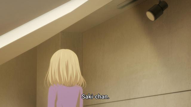 Doloris, a blonde haired chick from Ave Mujica, looks away from the camera as her subtitles read "Saki-chan"
