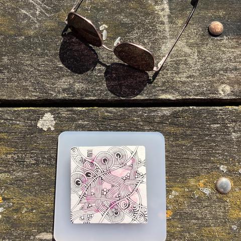 Finished ink on a picnic bench with my sunglasses