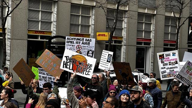 #Chicago #HandsOff #Protests

#German sign says "Achtung!! Das Spiel Ist Aus!!" — Not sure what it means, but apparently it means "Danger! The Game Is Over!" — These people know a thing or two about #Nazism and #fascism.

Another says, "There Will Be #Hell #Toupee" with a caricature of #Trump hair-do.

Yet another: "Hey #Technofascist #Broligarchs, Clean Up After Your #DOGE" — Good one!

Also a WHOLE BUNCH of "Hands Offs"
#ScienceFunding 
#TransRights 
#OurScientists 
#OurStudents 
#OurLibraries