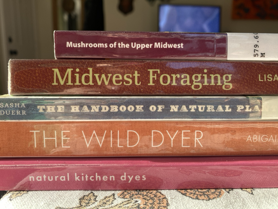 A stack of books about foraging and natural dying