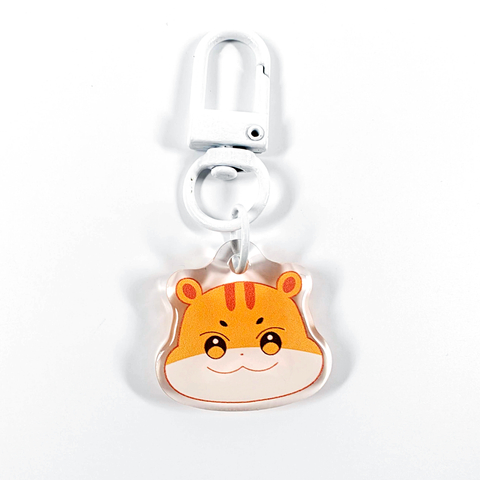 A picture of an acrylic keychain of Hongjoong's Aniteez animal from the K-Pop group ATEEZ. It's the head of the squirell smiling like his original design. The rim of the keychain is clear. It has a white clasp.