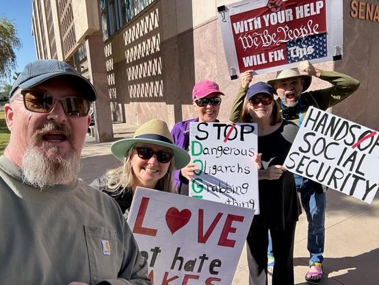 The crew ready with their signs for the rally