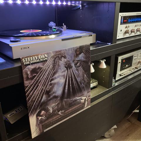 It's a retro stereo system. Steely Dan's "The Royal Scam" album cover is prominently displayed. 