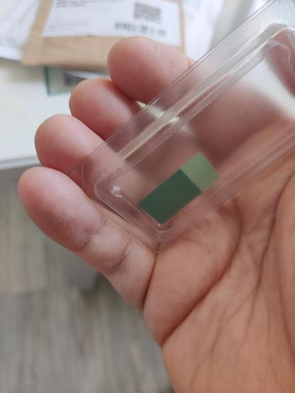 A small thermal pad in a plastic protective enclosure. 