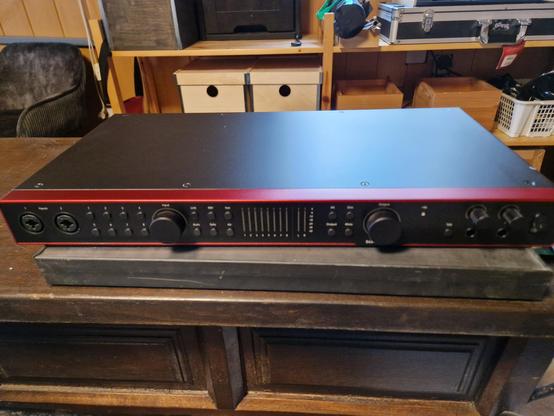 USB Audiointerface. Black with a tiny metallic red frame