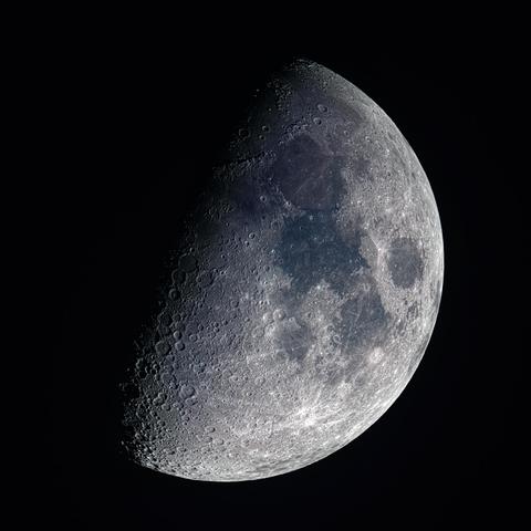 First Quarter Moon with a hint of blue-ish mineral colors in the darker areas. 