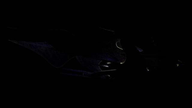 A fan-made 3D model of the White Star spaceship from Babylon 5. A sleek, organic ship with an animalistic shape resembling a bird or shark, it has smooth gray skin covered in mottled purple patterns with patches of blue, red, green, and gold flakes. The ship is backlit, almost vanishing against the black background, but light is visible shining through the thin edges of the fins and wings.