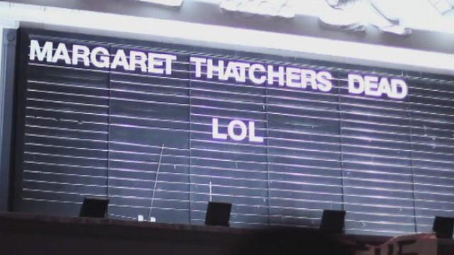 Street sign: MARGARET THATCHER'S DEAD, LOL.