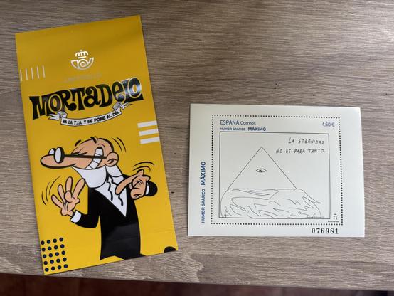 Sello nft de Mortadelo y sello de una ilustración de maximo donde sale un triángulo con un ojo dentro símbolo De Dios diciendo: la eternidad no es para tanto