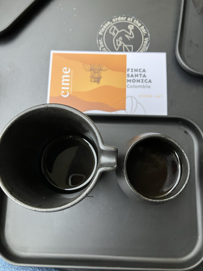 Pour over coffee, served on black porcelain 