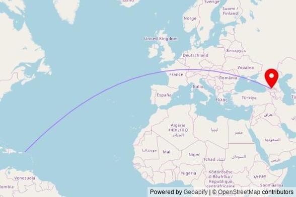 A map showing the great circle route from Road Town in the Virgin Islands, British to a map pin at St. Mary's Church, Armenian Street, 500200 Tskhinvali, Georgia
