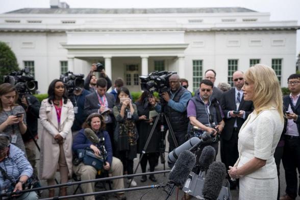 Media and speaker in front of White House