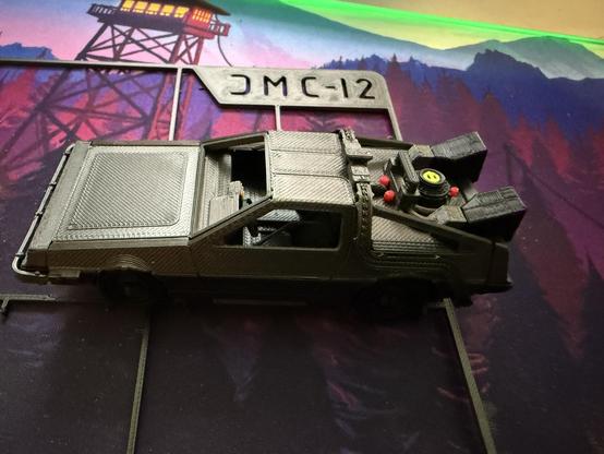 A 3D printed kit card of the delorean Time Machine from Back to the Future.