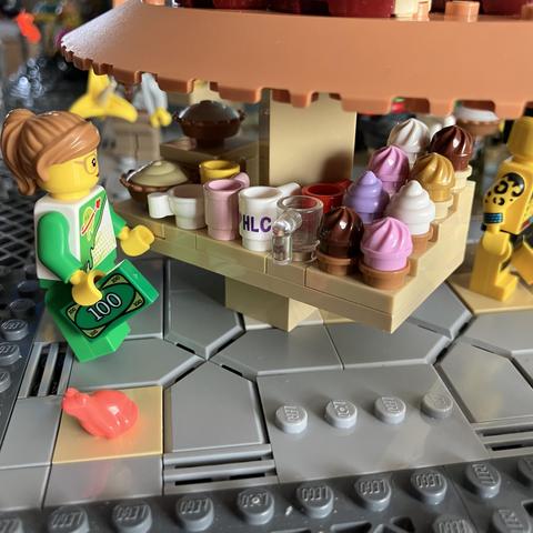 Little Caz has found the cake stall! And has a $100 in her hand…