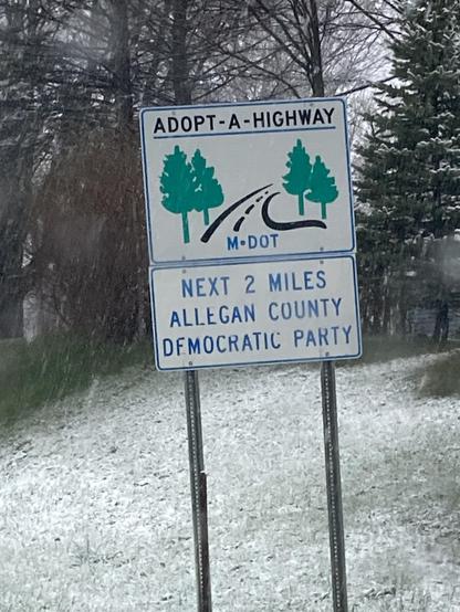 ADOPT-A-HIGHWAY
M-DOT
NEXT 2 MILES ALLEGAN COUNTY DEMOCRATIC PARTY
Artwork shows four pine trees and a road with dotted line down the middle.
