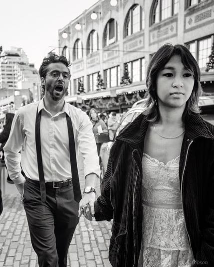 Couple crossing street while holding hands