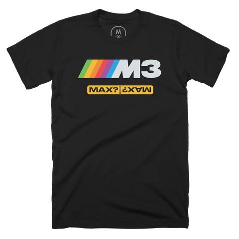 A black t-shirt with an ATP-style rainbow-striped “M3” logo with a gold badge below it that shows two instances of the word “Max?” stuck end to end.