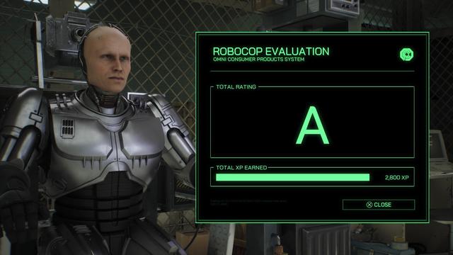 The image features a humanoid robot with a bald head and a metallic body sitting in a sparse environment. On the screen beside it, a green-highlighted evaluation display shows a total rating of "A" and "2,800 XP" earned. 