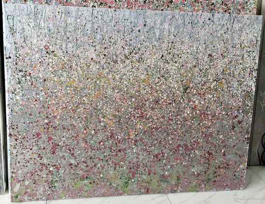 a painting done with drips and splatters, it is an abstract-impressionist field of flowers, lots of silver and red and green and pink