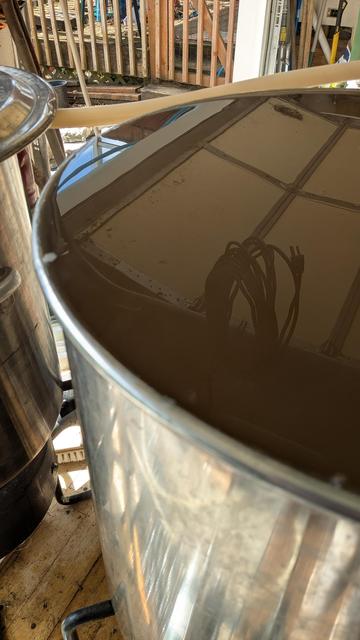 The rim of my brew kettle with wort right up to and overflowing it.